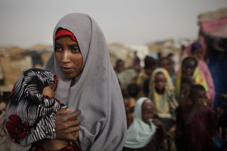 Mother and child awaiting food and medical assistance. Photo Credit: Ed Ou/Getty Images for Save the Children.